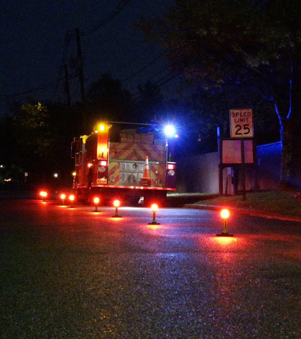 BEACON-4-LIFE LED Road Flare used at a scene with emergency responders.